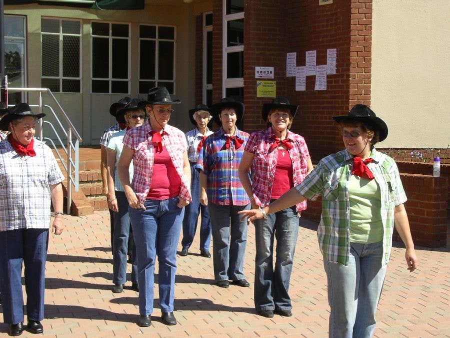 Country dancers keeping the folks entertained