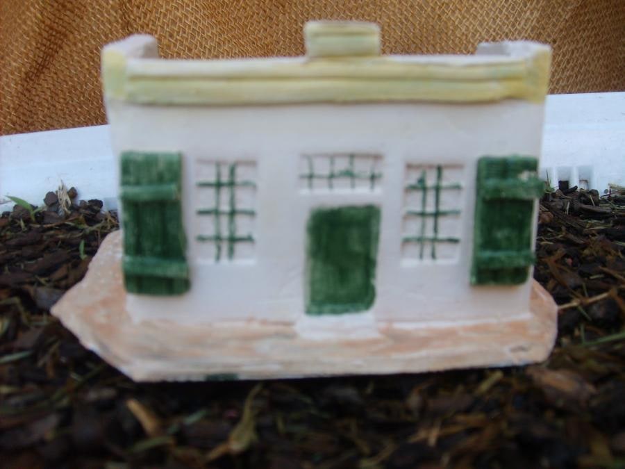 Hand crafted each house being unique in earthenware or cast in resin