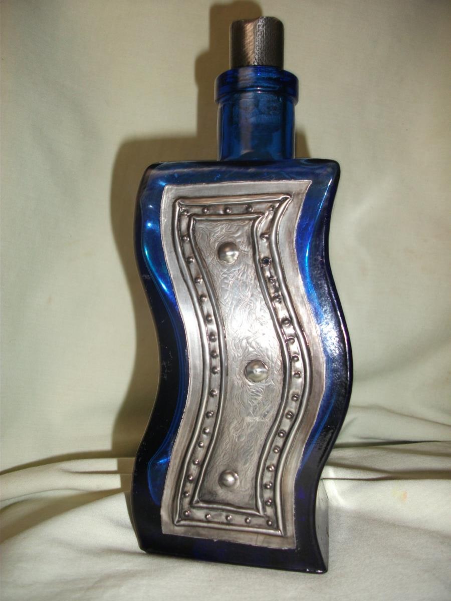 Pewter on blue glass bubble bath bottle