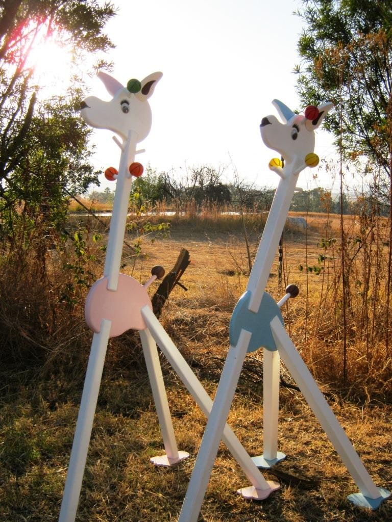 Giraffe Clothes stand furniture/accessory to any children's room. Available in various colours.