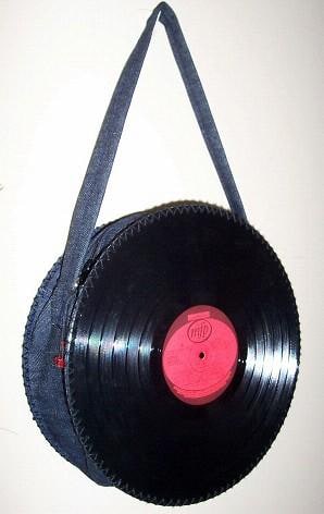 This bag is made with two old records and upcycled jeans. It has a zip so nothing can fall out. A fun funcky way to recycle!