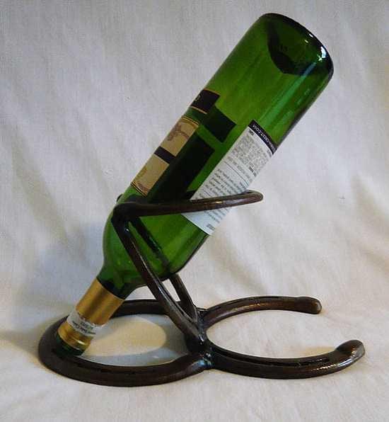 Single Wine holder made from hand selected recycled horseshoes,polished and crafted to the specific craft