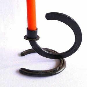 Hand crafted Candle holder. Made from hand selected recycled horseshoe, cleaned , polished and crafted to the specific craft.
