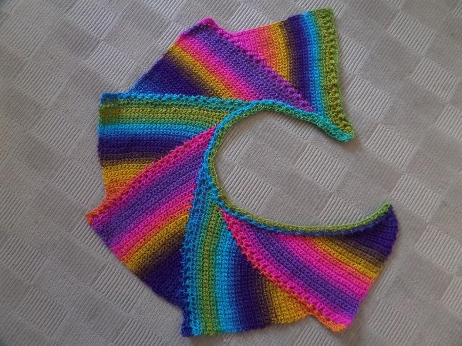 This stunning, cozy shawl can match any colour scheme.  The yarn is a premium acrylic yarn, delightfully soft to the touch.

R400